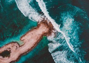 sand rock island deep green sea